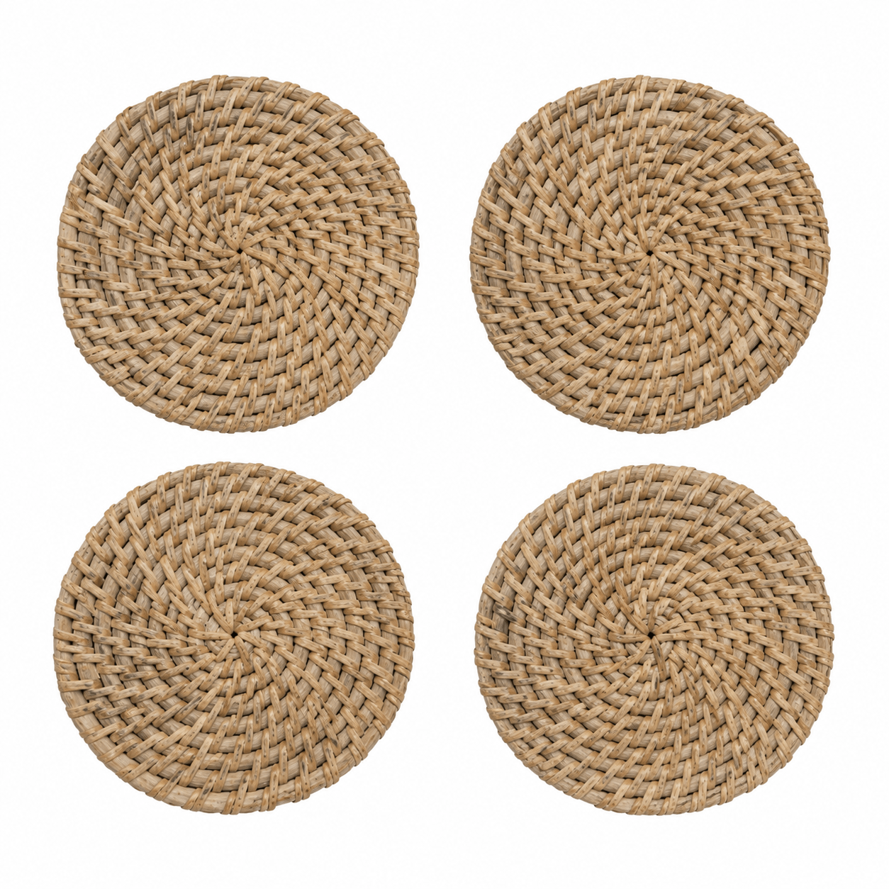 Four round woven seagrass or straw placemats arranged in a 2x2 grid on a plain white background.