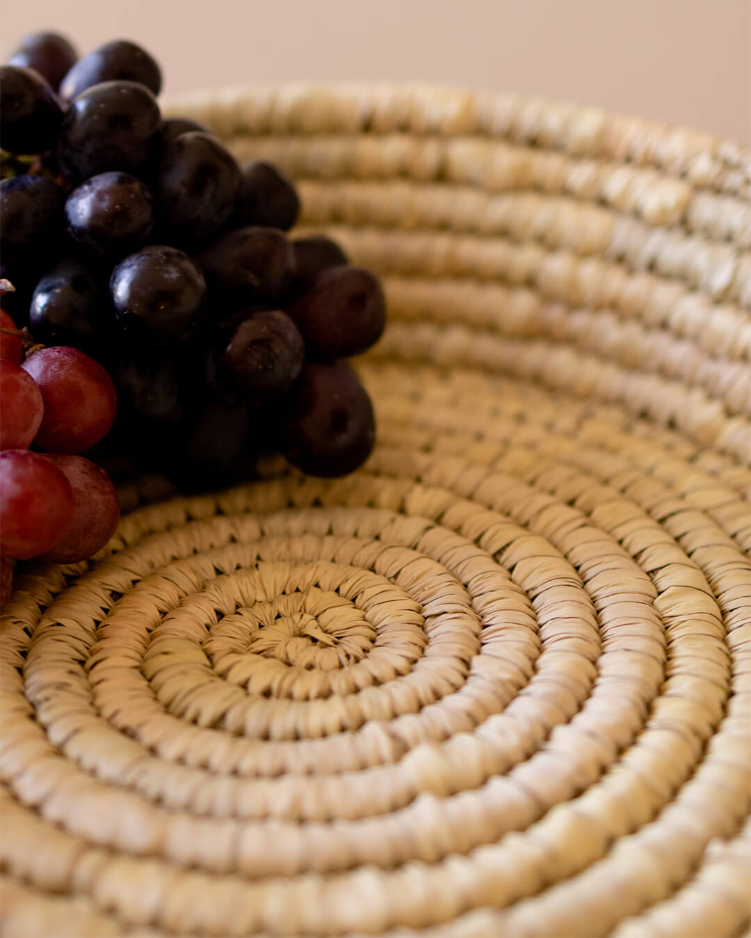 Round rattan tray by Kolus