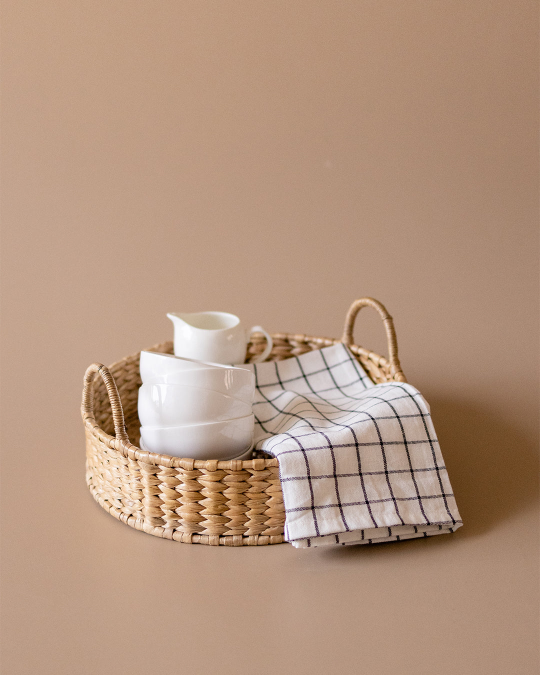 Round wicker serving tray by Kolus